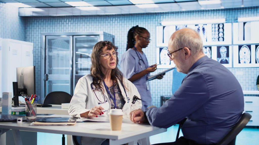 Medical sales representative meeting with a physician