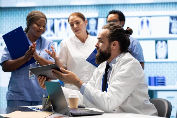 Healthcare team discussing coverage and payment for a new product